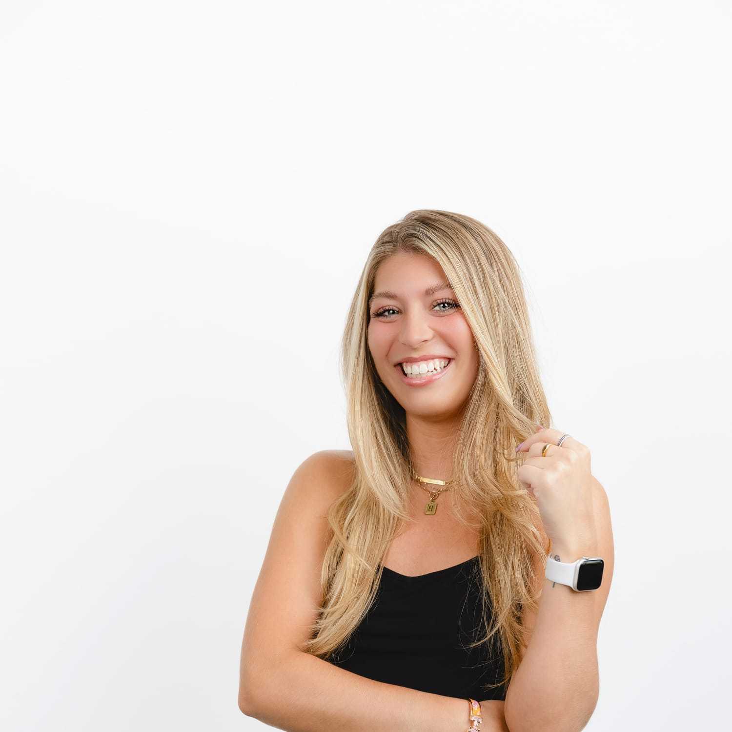 Portrait of Bella, a professional stylist at Bobby Cooper, showcasing their expertise and style.