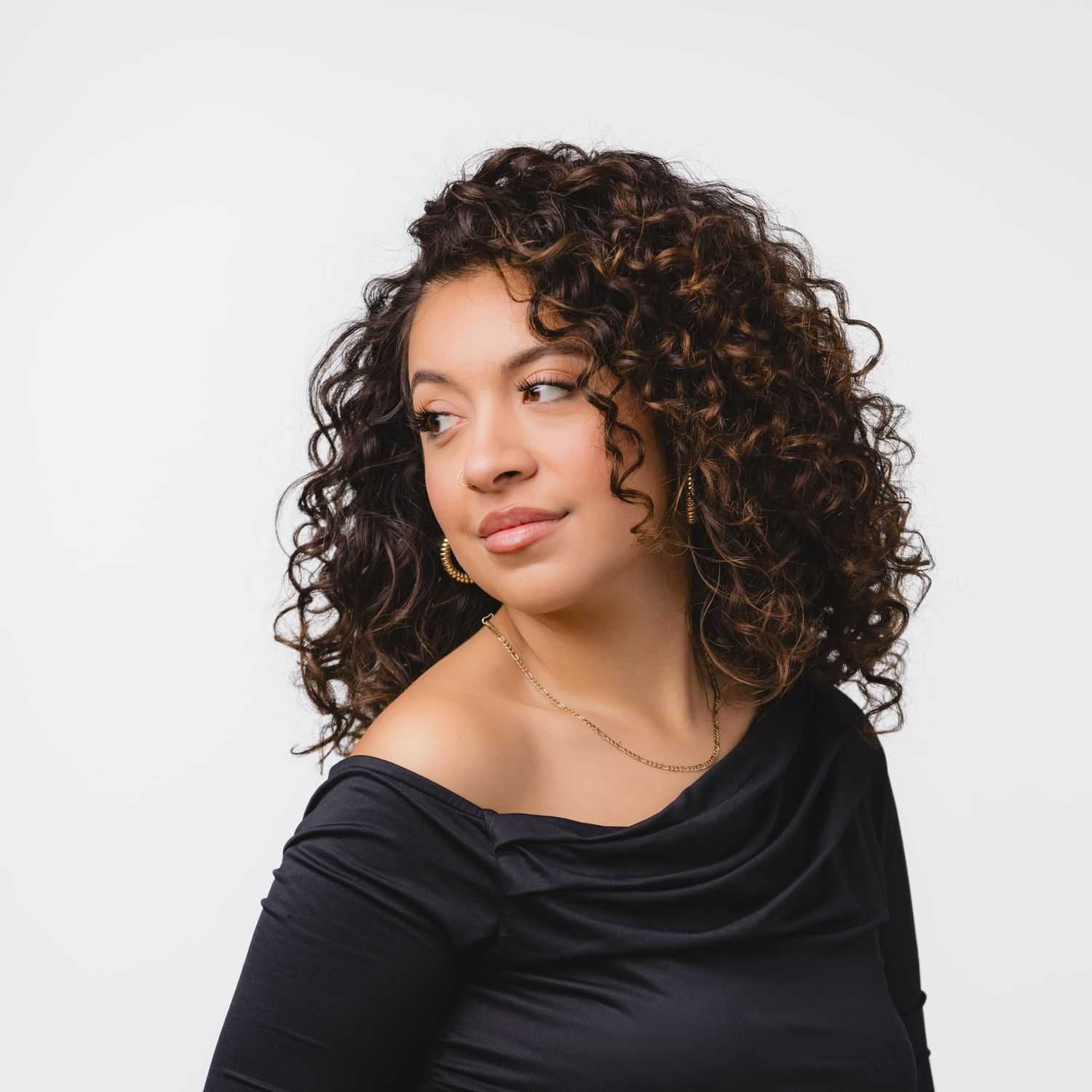 Portrait of Cass Cazares, a professional stylist at Bobby Cooper, showcasing their expertise and style.