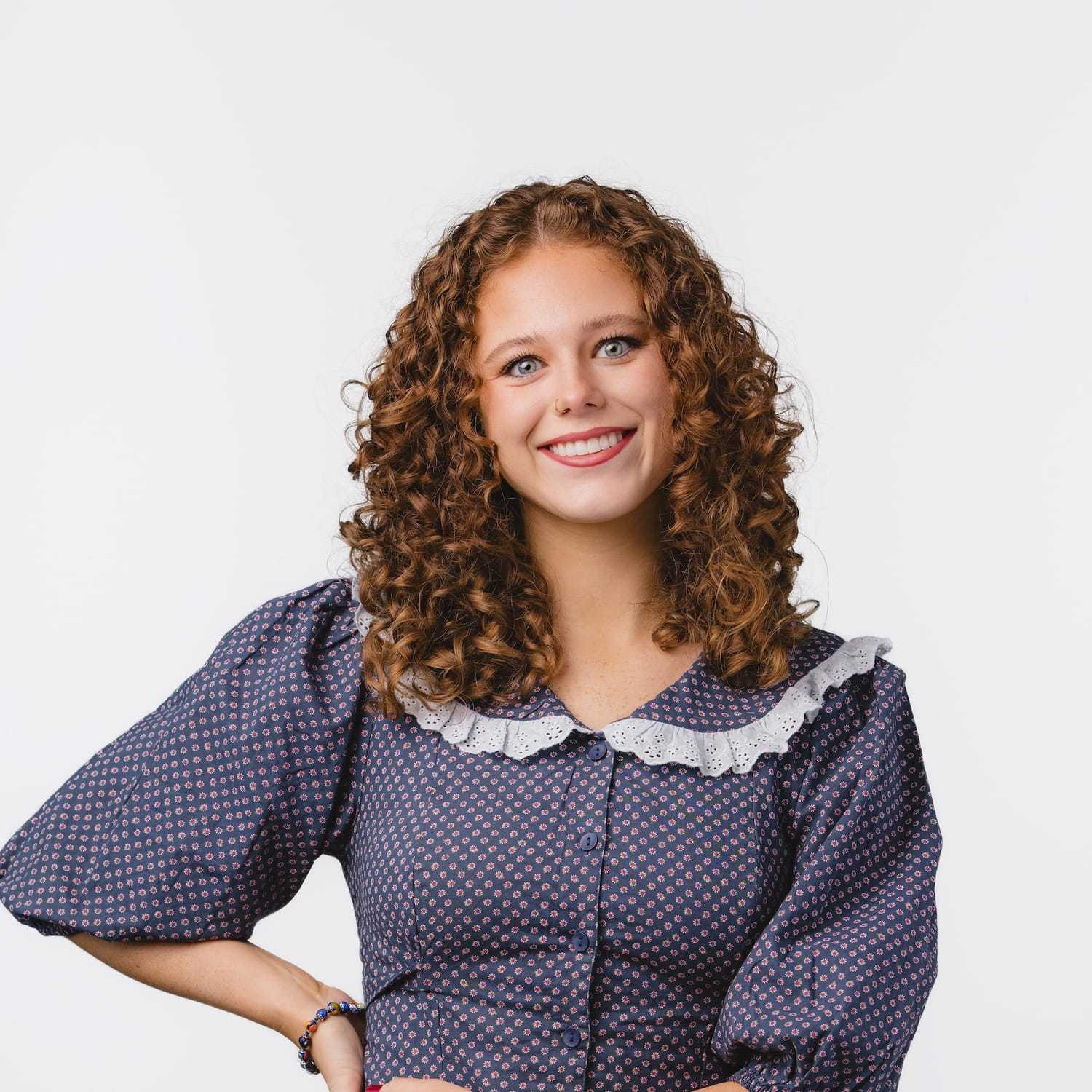 Portrait of Frannie, a professional stylist at Bobby Cooper, showcasing their expertise and style.