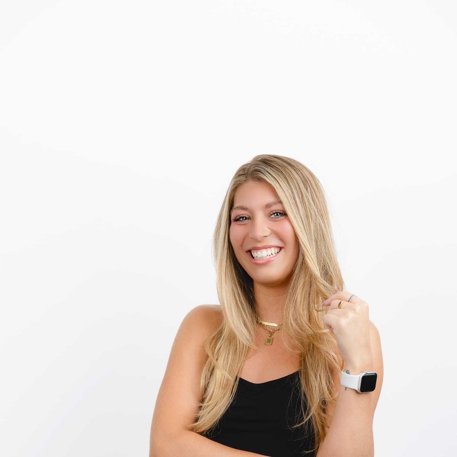 Portrait of Bella, a professional stylist at Bobby Cooper, showcasing their expertise and style.