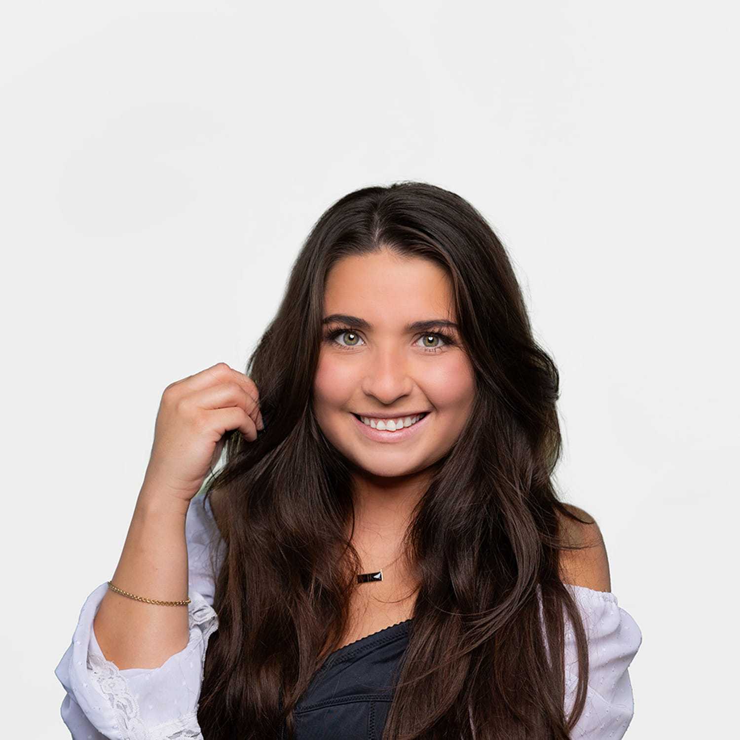 Portrait of Emma, a professional stylist at Bobby Cooper, showcasing their expertise and style.