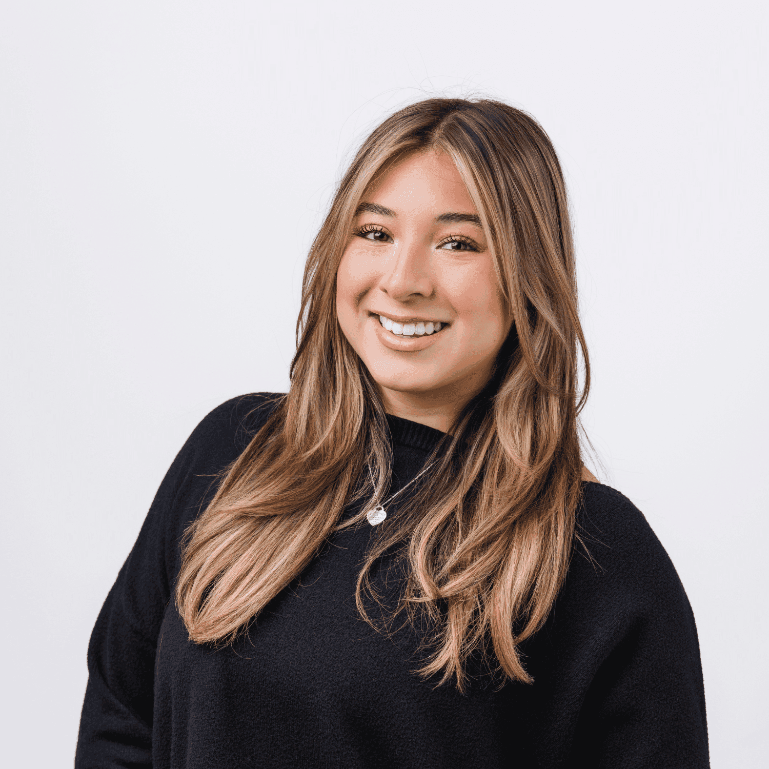 Portrait of Sofia, a professional stylist at Bobby Cooper, showcasing their expertise and style.